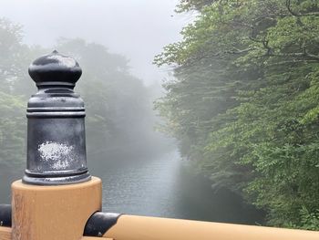 Scenic view of lake during foggy weather