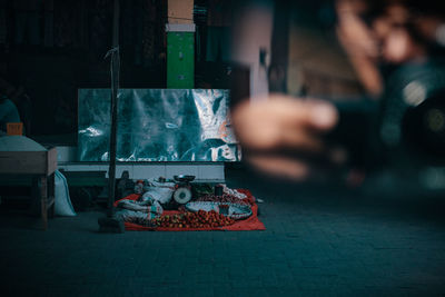 Cropped hand of man against food at market