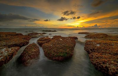 Scenic view of sea against sky at sunset