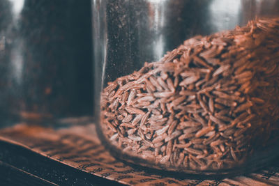 High angle view of bread in glass container on table