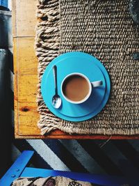 High angle view of coffee cup on table