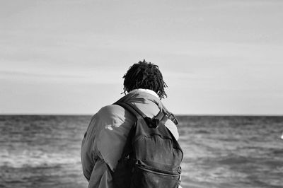 Rear view of woman on beach