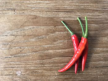 High angle view of red chili peppers on table