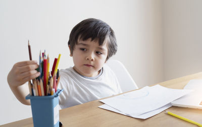 Boy sitting at table