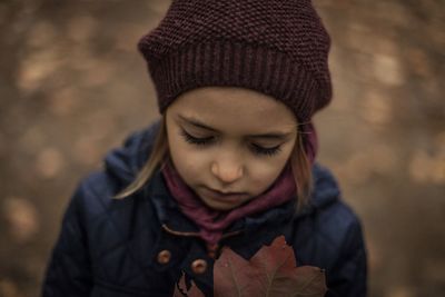 Close-up of girl wearing knit hat during autumn