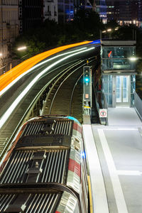 Light trails on road in city at night