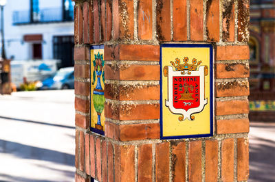 Coat of arms on brick column at vejer de la frontera