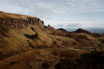 Rock formations on landscape against sky