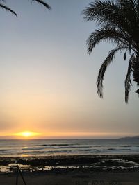 Scenic view of sea against sky at sunset