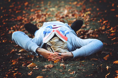 Close-up of woman standing on bench