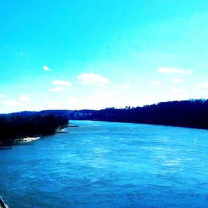 Scenic view of sea against blue sky