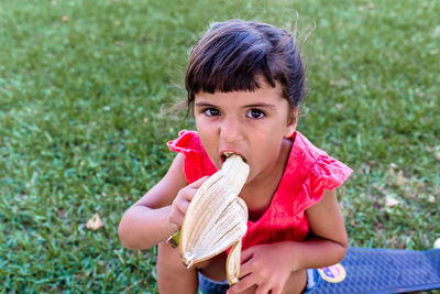 Portrait of young woman eating healthy