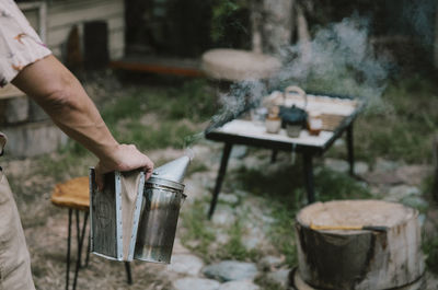 Low section of man preparing food