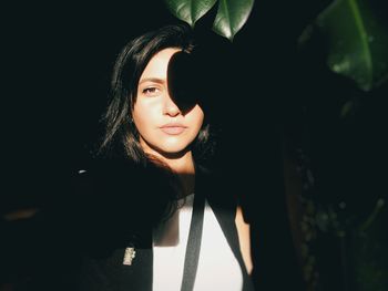 Portrait of beautiful young woman looking away