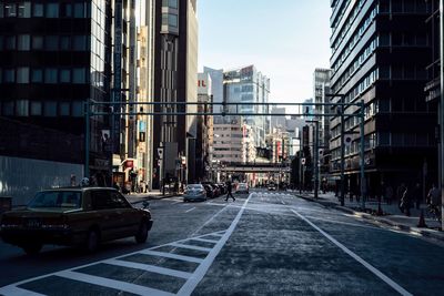 Road in city against sky