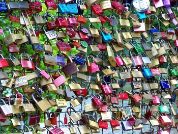 Full frame shot of colorful love locks on railing