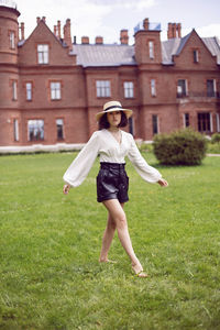 Full length of woman standing on field