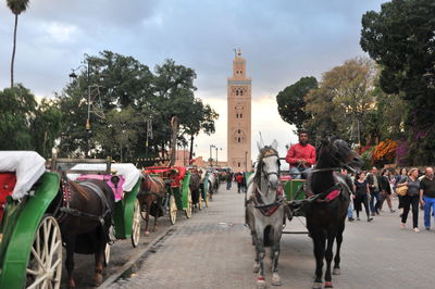 Group of people walking in front of building