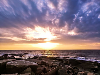 Scenic view of sea against sky during sunset