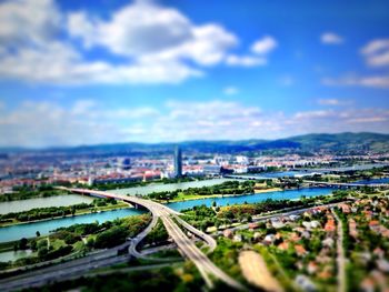 Cityscape against cloudy sky