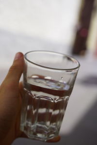 Close-up of hand holding drink