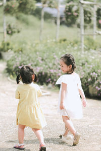 Girl and woman walking outdoors