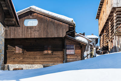 Winter magic. the ancient wooden houses of sauris di sopra. italy