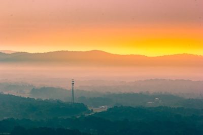 Scenic view of silhouette mountains against sky during sunset