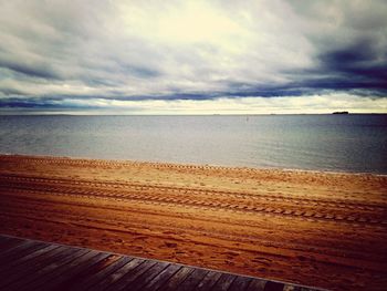 Scenic view of sea against cloudy sky