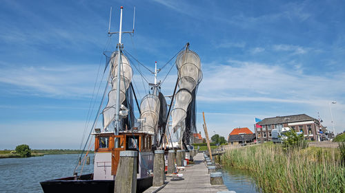 Traditional sailboat in harbor in workum in the netherlands 