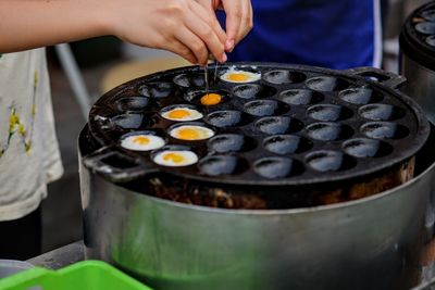 Close-up of person preparing food