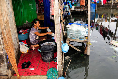 Young couple sitting on boat in water