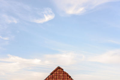 Low angle view of roof against sky
