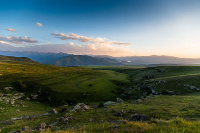 Scenic view of landscape and mountains against sky