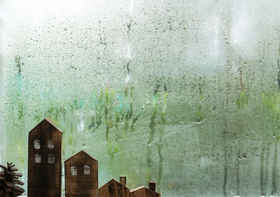 Wet glass window of building