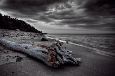 Abandoned sand on beach against sky