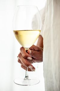 Close-up of drink in glass against white background