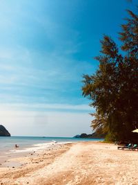 Scenic view of beach against blue sky