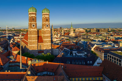 Wonderful sunset shining onto the frauenkirche towers in munich, germany