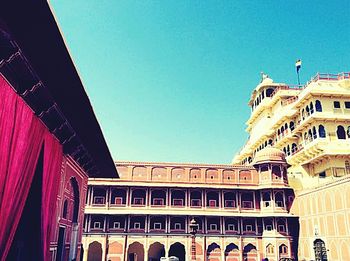 Low angle view of building against clear blue sky