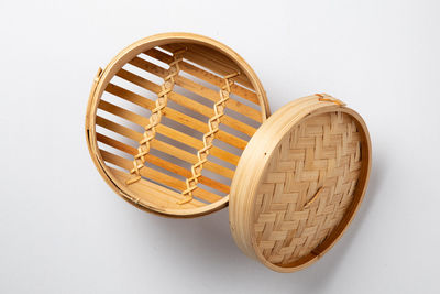 High angle view of wicker basket on white background