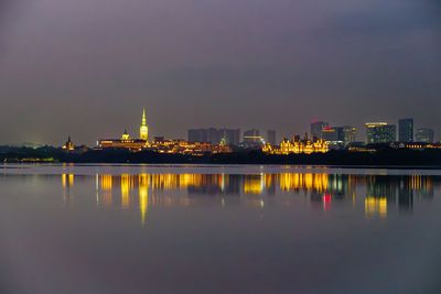 Illuminated buildings in water