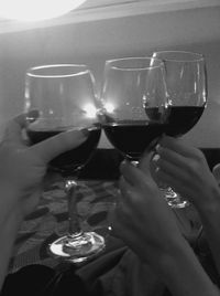 Close-up of hand holding beer glass