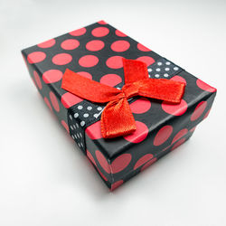 High angle view of red heart shape on white background