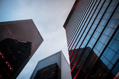 Low angle view of modern buildings against sky in city