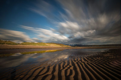 Scenic view of agricultural landscape against sky