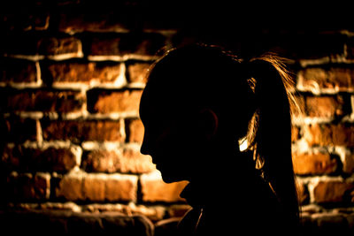 Portrait of silhouette man against wall