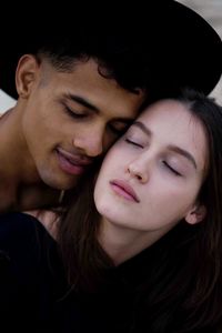 Close-up portrait of young couple