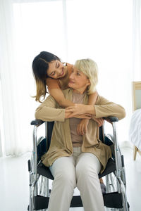 Young couple sitting in front of woman