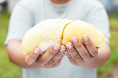 Midsection of man holding food